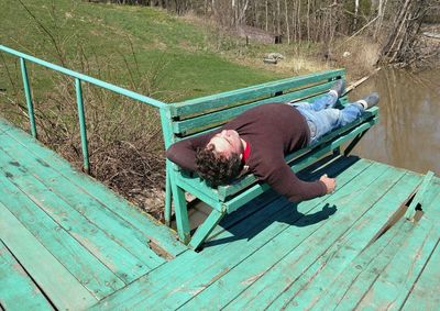 High angle view of man sleeping on floor