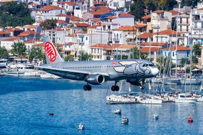 Aerial view of city by sea