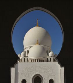 Low angle view of church against blue sky