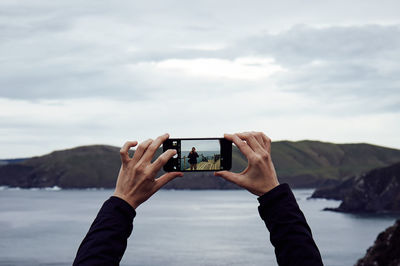 Man photographing through camera