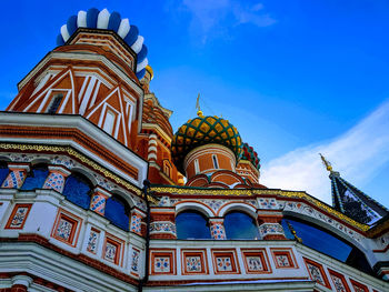 Low angle view of temple building against blue sky