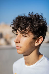 Close-up of handsome young man looking away