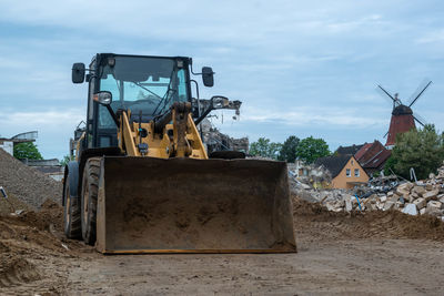 Construction site on field against sky