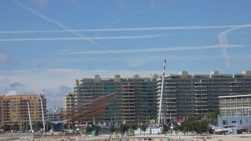 Buildings in city against sky