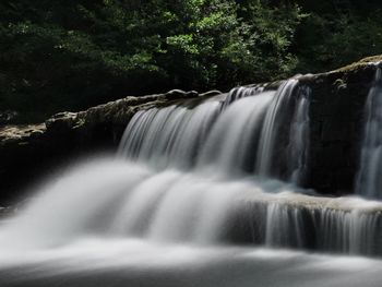 Scenic view of waterfall in forest