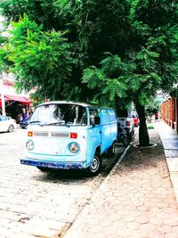 Cars parked on street in city