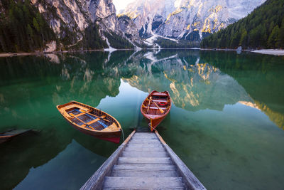 Boat on lake by mountains