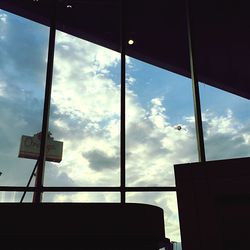 Low angle view of building against cloudy sky