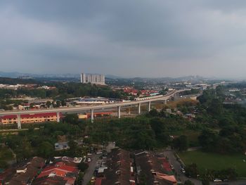 Aerial view of city against sky