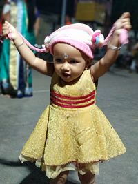 Full length of cute girl standing on street