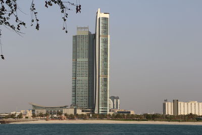 Skyscrapers in city against clear sky