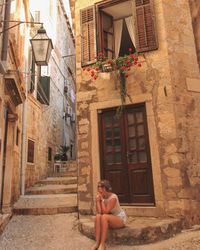 Man in front of building