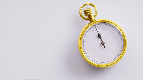 Close-up of stopwatch on white background