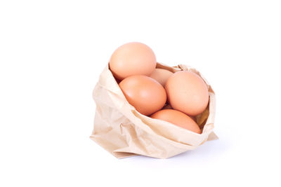 High angle view of eggs against white background