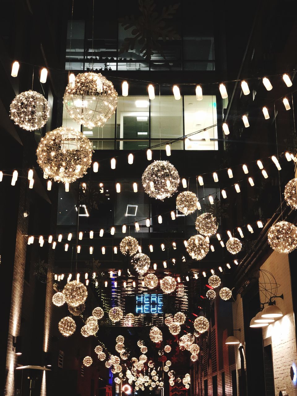 LOW ANGLE VIEW OF ILLUMINATED CHANDELIER