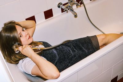 High angle view of woman in bathroom