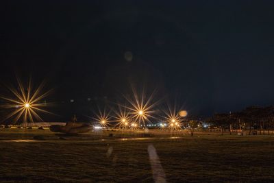 Illuminated street lights at night