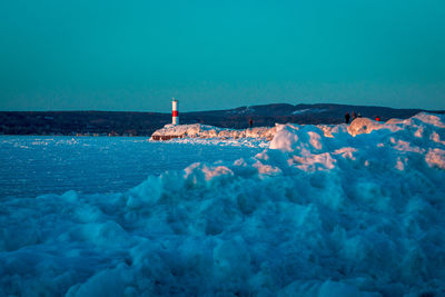 Beautiful sunset shot of the light house in petoskey michigan during sunset