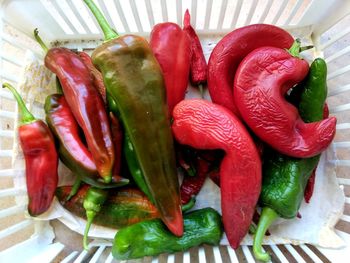 Close-up of red chili peppers on table