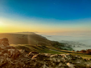 Scenic view of landscape against sky during sunset