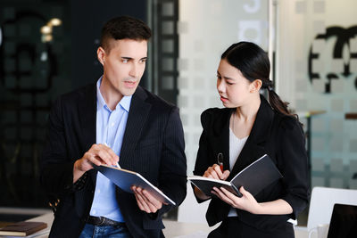 Businesswoman using digital tablet in office