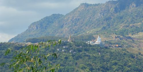 Scenic view of tree mountains against sky