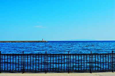 Scenic view of sea against clear blue sky