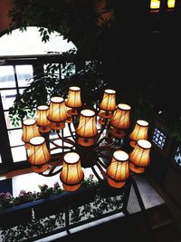 Illuminated lanterns hanging on tree