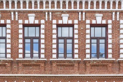 Windows, details of red brick historical building in yelabuga, russia