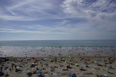 High angle view of people on beach against sky