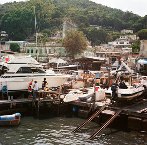 Boats moored at harbor