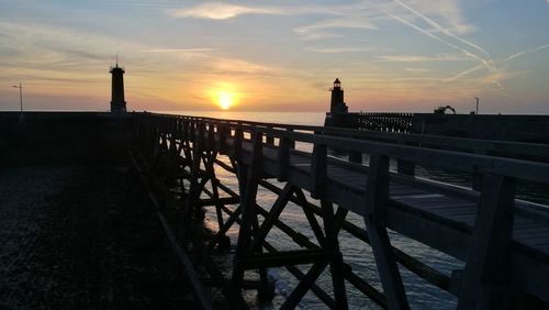 Silhouette of lighthouse at seaside