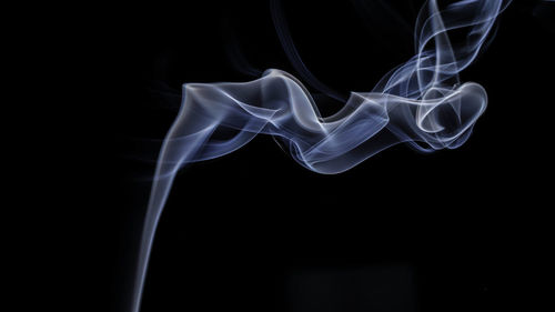 Close-up of abstract over black background