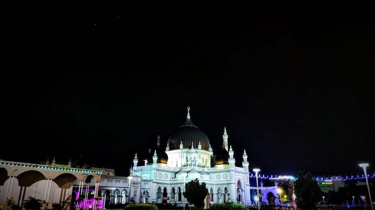 ILLUMINATED BUILDINGS AT NIGHT