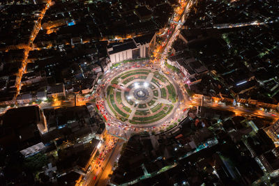 High angle view of illuminated buildings in city at night