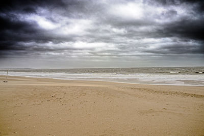 Scenic view of beach against sky