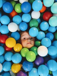 High angle portrait of boy in ball pool