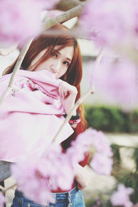 Portrait of woman with pink flowers