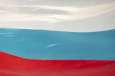 Flag of russia in waves. vibration of fabric in wind. colors of national flag. 