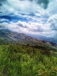 Landscape with mountains against cloudy sky