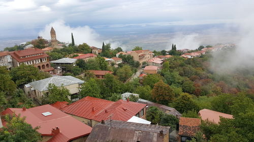 Houses in town against sky