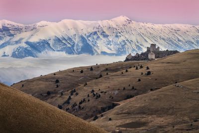 Scenic view of snowcapped mountains against sky