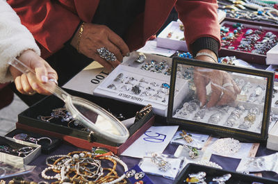 Midsection of women shopping at street market