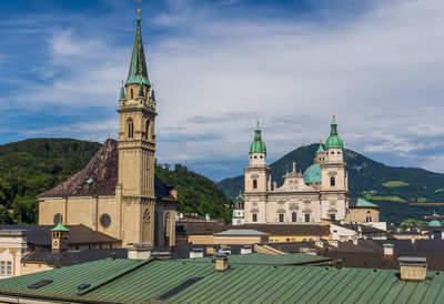 Cathedral of building against cloudy sky