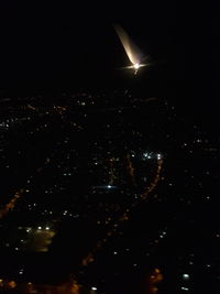 Aerial view of illuminated city at night