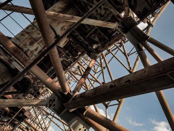 Low angle view of abandoned factory against sky