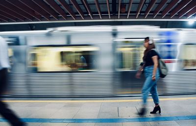 Blurred motion of train at railroad station