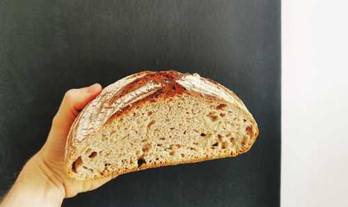 Close-up of hand holding bread