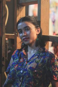 Portrait of young woman wearing sunglasses