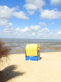 Scenic view of beach against blue sky